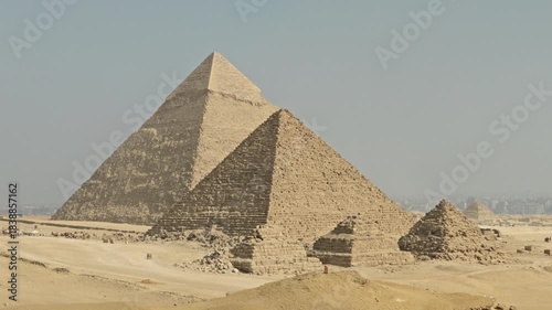 A panorama of the Giza Necropolis featuring the three principal pyramids built for Pharaohs Khufu, Khafre, and Menkaure, surrounded by the desert landscape.