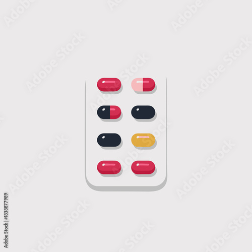 Colorful blister pack with assorted pills and capsules isolated on light background representing medication and healthcare concept