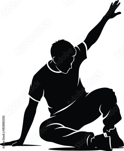 Silhouette of a man performing a breakdance pose reaching upward