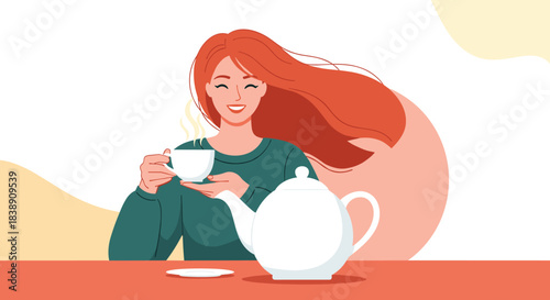 Smiling young woman with flowing red hair enjoys a warm cup of tea, a cozy moment with a white teapot on a red table.