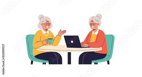 Two elderly women, one talking and holding a mug, and the other using a laptop, enjoy a friendly gathering at a table.