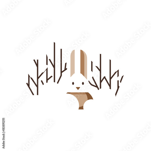Rabbit hiding in snow-covered thicket among bare branches  
