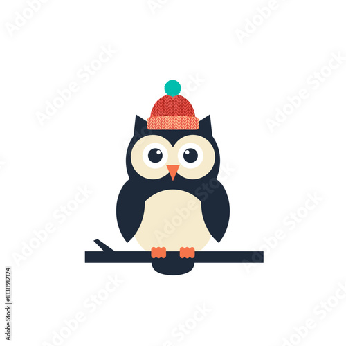 Owl wearing a knitted hat while perched on a branch in winter  
