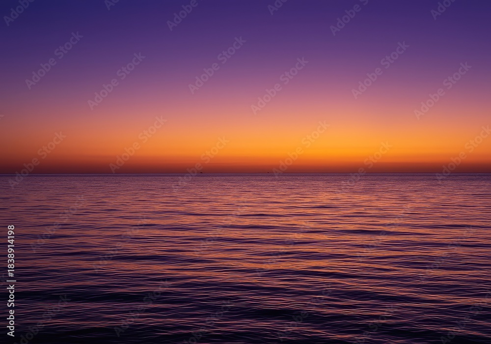 Obraz premium A tranquil ocean scene at the moment of twilight, featuring colorful gradients of purple and orange above the horizon line ,twilight ,reflection ,peaceful