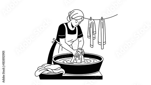 Dedicated woman hand washing laundry in basin with clothes drying on line outdoors