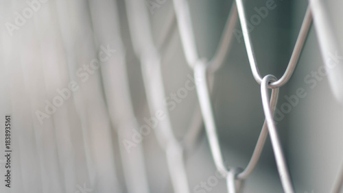 Close-up view of a metal chain-link fence