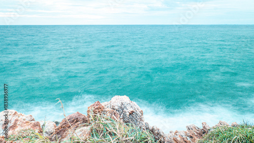 Rocky Australian coastline with crystal clear waters and waves