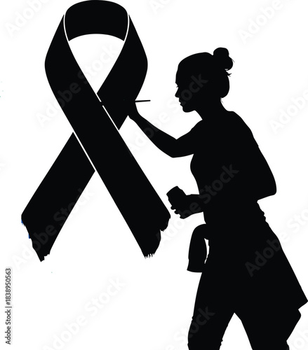 Silhouette of a woman painting a black awareness ribbon with a brush