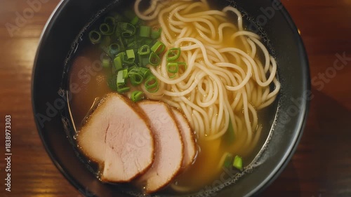 Delicious Japanese Ramen Bowl with Pork and Scallions.