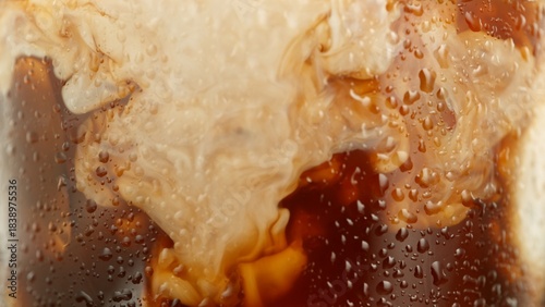 Macro Shot of Pouring Milk into Ice Coffee, Close-up