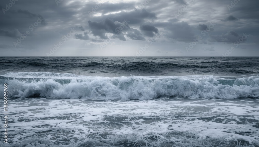 Fototapeta premium Dramatic ocean waves crashing under moody gray skies 