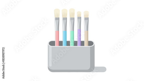 Five colorful makeup brushes standing upright in a light gray holder