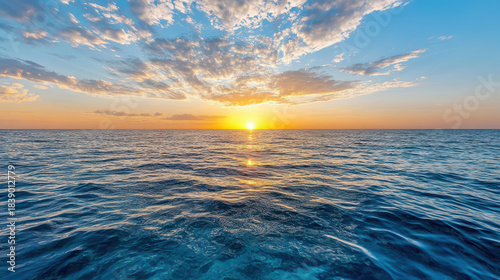 Fototapeta Naklejka Na Ścianę i Meble -  Mirror like sea surface at sunset peaceful warm horizon glow