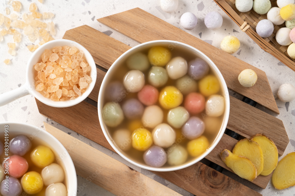 Fototapeta premium Colorful sweet glutinous rice balls tangyuan in sweet ginger syrup soup