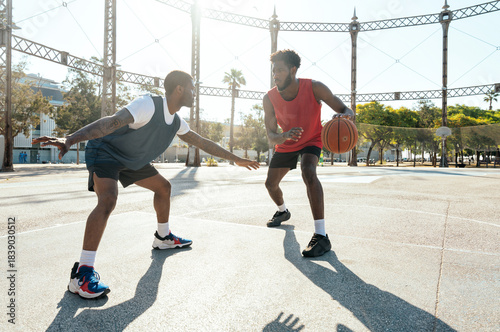 фотографія Young basketball players training at the court.