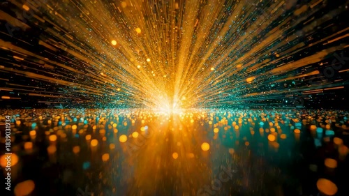 Exploding burst of golden and blue particles radiating outward from a bright center on dark background.