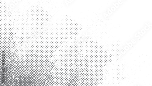 Monochrome halftone grunge overlay texture for artistic and modern graphic applications. Abstract mild textured halftone effect in black on white for clean grunge backgrounds. 