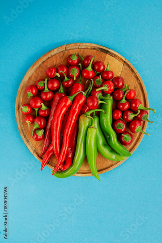 Red, hot chili pepper composition, spicy organic paprika and different seasonings background