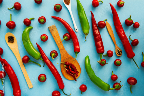 Red, hot chili pepper composition, spicy organic paprika and different seasonings background