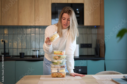 Checking Prepared Meal Above a Balanced Stack