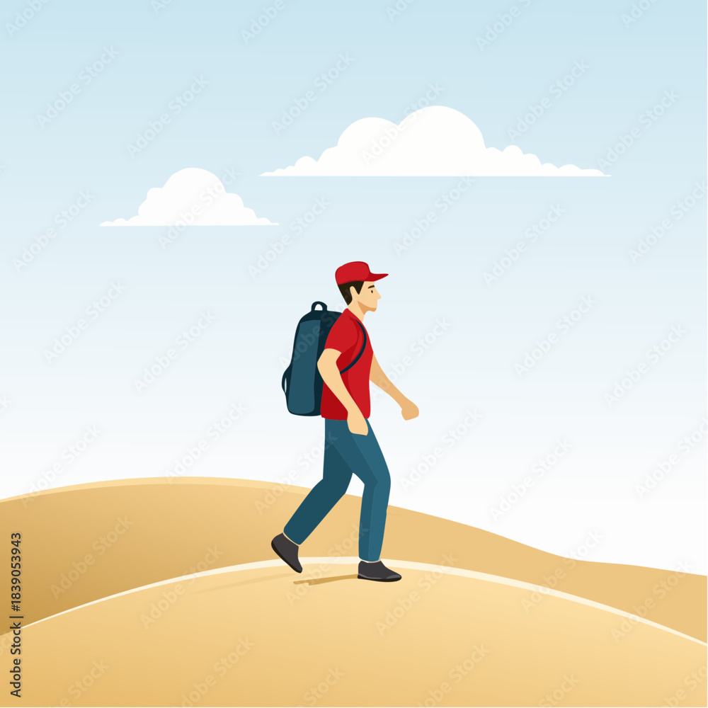 Obraz premium A young man with a backpack walking on a sandy hill under a clear blue sky with white clouds