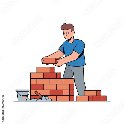 Construction worker building a brick wall with tools and materials