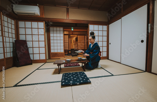 Canvastavla Woman wearing a kimono performing the chado ritual, preparing and serving ceremo