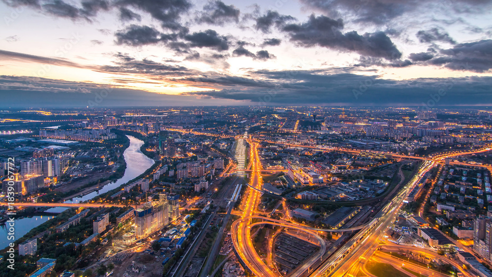 Fototapeta premium Aerial top view of Moscow city day to night timelapse after sunset. From the observation deck