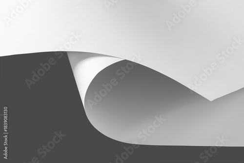 Sheets of white paper in black and white.