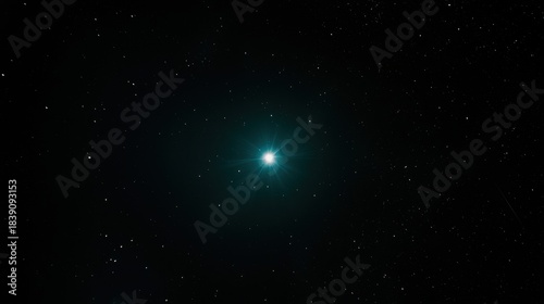 A starry night sky with a bright blue star in the center.