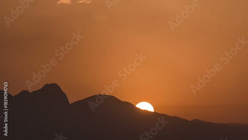 Fototapeta Naklejka Na Ścianę i Meble -  Seascape timelapse of high mountains over clear sunset sky in Turkey