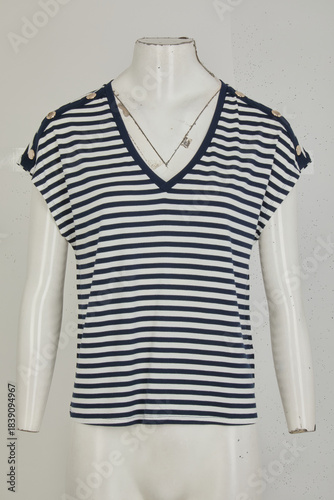 Classic navy and white striped v neck t shirt with rolled cap sleeves on a mannequin
