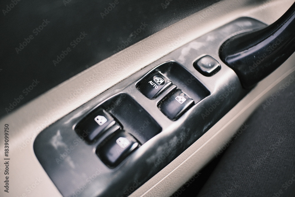 Obraz premium Set of close-up shots of a car interior featuring climate control buttons, dashboard switches, air vents, and electric window controls. Detailed automotive components showcasing design, 