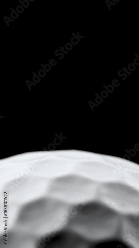 Closeup of rotating golf ball with copy space