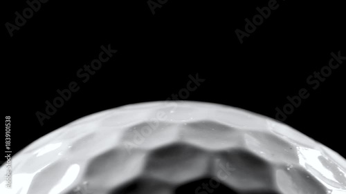 Closeup of rotating golf ball