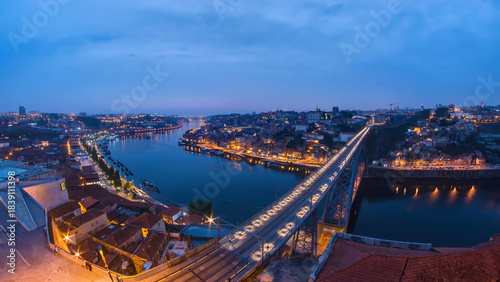 Day to night view of the historic city of Porto, Portugal timelapse with the Dom Luiz bridge