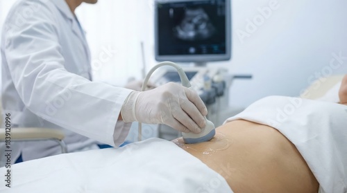 Doctor performing abdominal ultrasound scan on patient, medical diagnosis