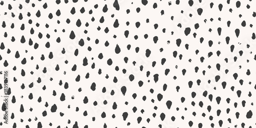 Seamless pattern with abstract black ink spots in brush stroke style, black and white colors, used for animal skin texture or modern textile design, vector illustration.