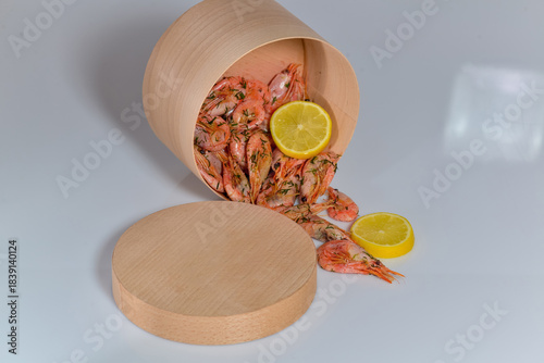 Delivery container with cooked shrimp on a white background