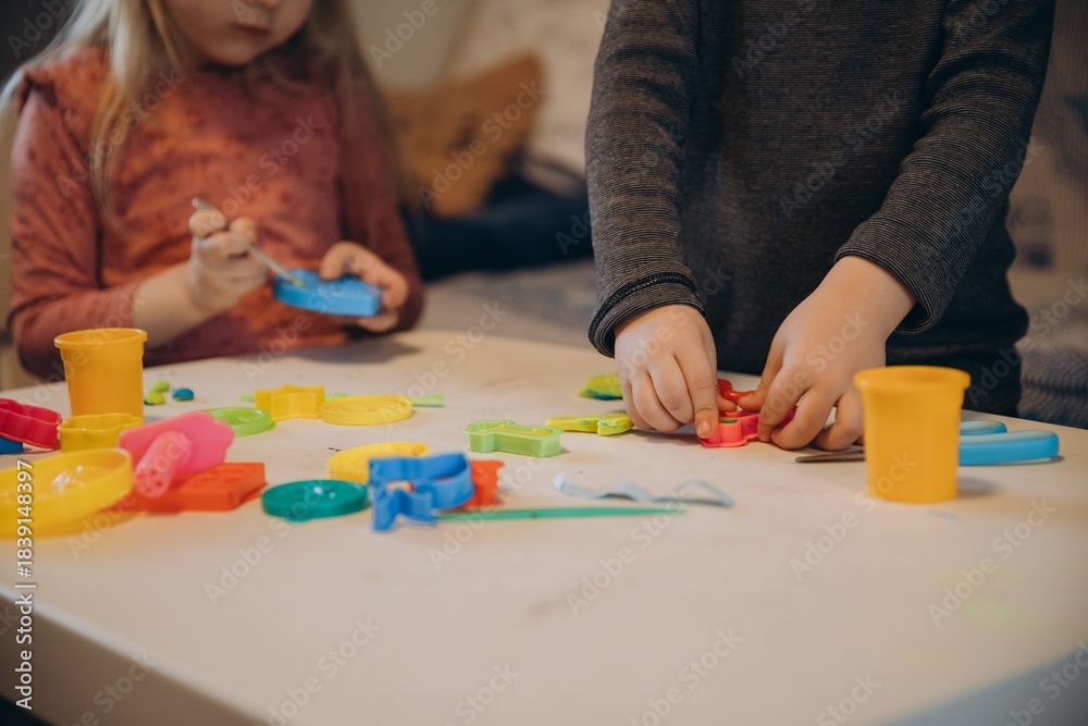 Fototapeta premium Children playing creative games with colorful play dough