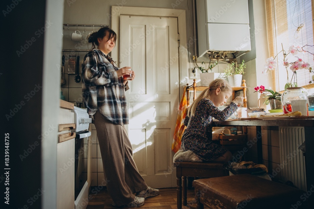 Fototapeta premium Mother and daughter enjoying quiet morning at home