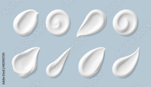 Cosmetic smears of creamy texture isolated on blue background. Set of cosmetic cream swatches. Cosmetic skin care product. Vector realistic illustration