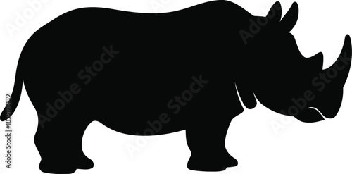 Silhouette of a powerful rhinoceros standing in a natural pose