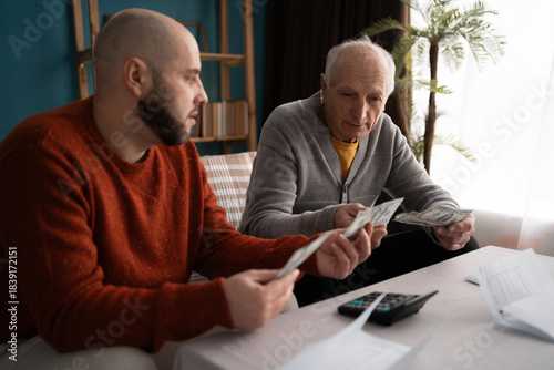 Obraz na plátně adult son lends money to his Elderly father deal with financial problems