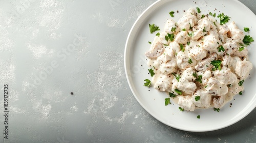 Creamy chicken dish on white plate