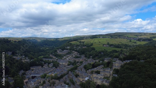 scenic aerial view of the town of hebden bridge town in summer surrounded by fields and trees