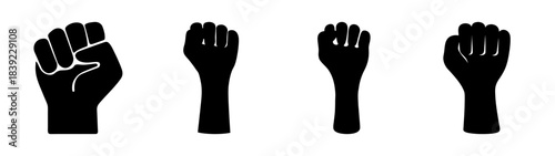 Four black raised fist symbols representing power strength unity and protest