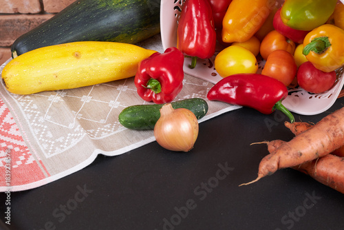 Autumn harvest, vegetables are lying near the basket.