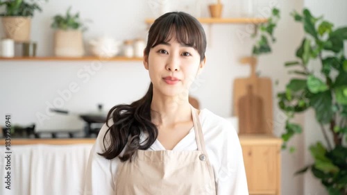 Young woman in modern kitchen.