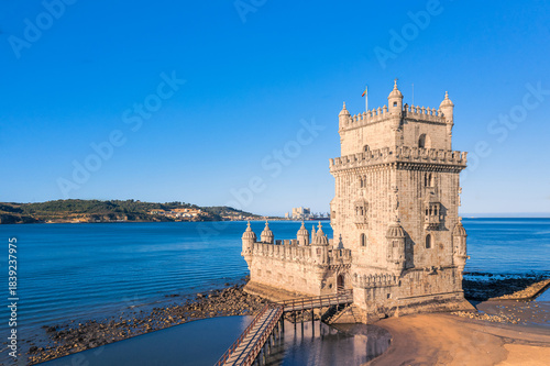 Photos Belem tower and Tagus river, Lisbon, Portugal at blue summer day sky